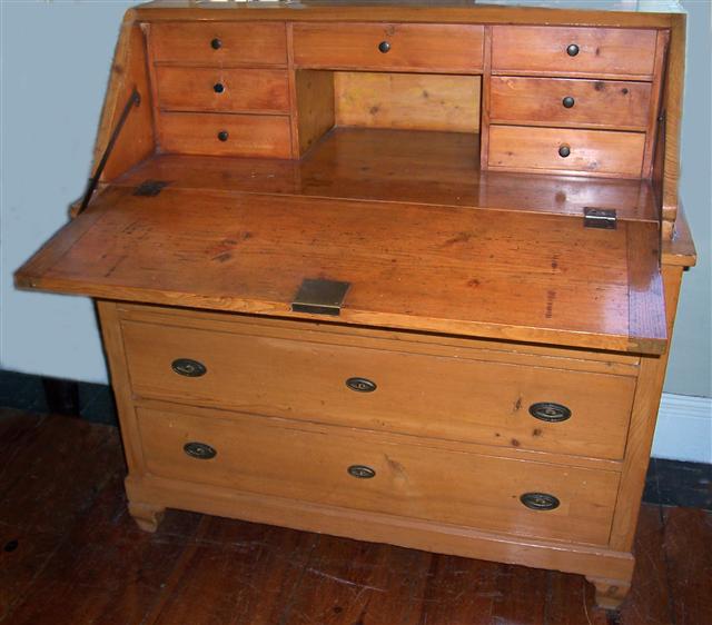 Item # 9246
Country pine slant front desk with four drawers. Swiss, 19th century. 47"w x 23"d x 47"h.
The finish on this desk has a nice warm patina.

Price $4,200